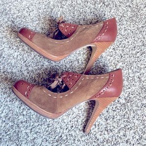 Brown and rust color heels with shoelace tie at the front heels